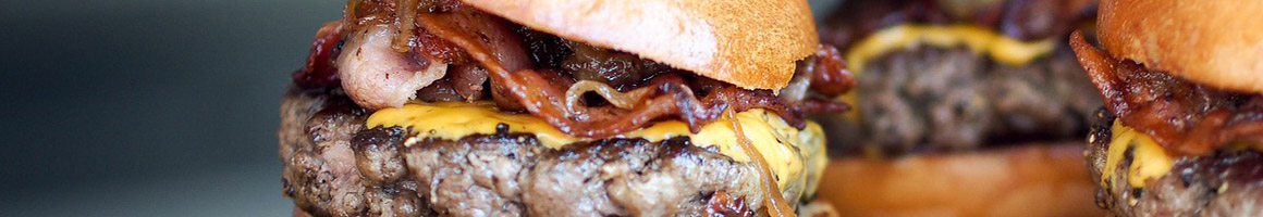 Eating Burger Sandwich at Yo-B Yogurt & Burgers restaurant in Wichita, KS.